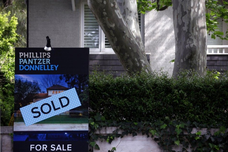 A real estate agent's sign outside a house shows that it has recently been sold in Sydney