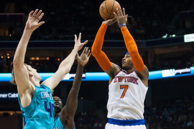 Dec 5, 2014; Charlotte, NC, USA; New York Knicks forward Carmelo Anthony (7) shoots the ball over Charlotte Hornets center Cody Zeller (40) during the first half at Time Warner Cable Arena.