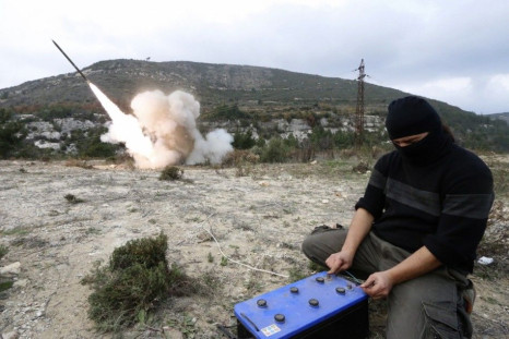 A rebel fighter fires a Grad long distance shell towards forces loyal to Syria&#039;s president Bashar Al-Assad located in the city of Jableh at the Syrian coast, from Jabal al-Akrad area in Syria&#039;s northwestern Latakia province December 4, 2014. Pic