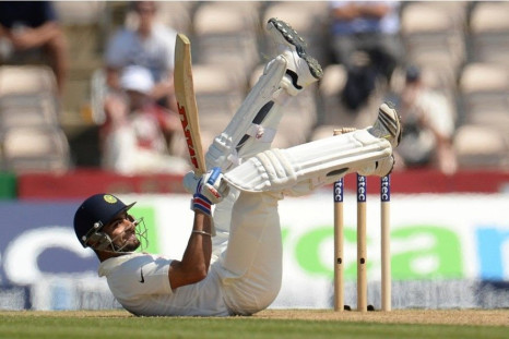 India&#039;s Virat Kohli rolls on the ground after avoiding a ball