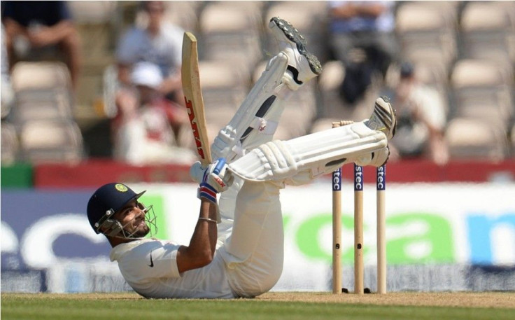 India&#039;s Virat Kohli rolls on the ground after avoiding a ball