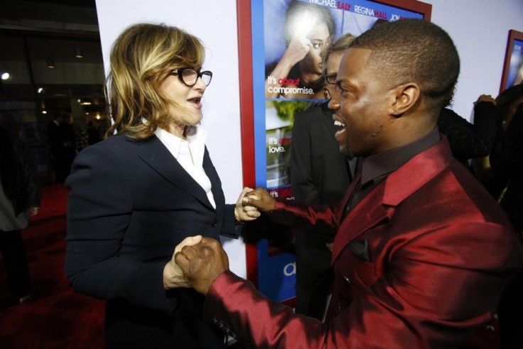 Cast member Kevin Hart (R) greets Amy Pascal, co-chairman of Sony Pictures Entertainment, Inc. and chairman of SPE&#039;s Columbia TriStar Motion Picture Group, at the premiere of &quot;About Last Night&quot; at the Cinerama Dome in Los Angeles, Californi