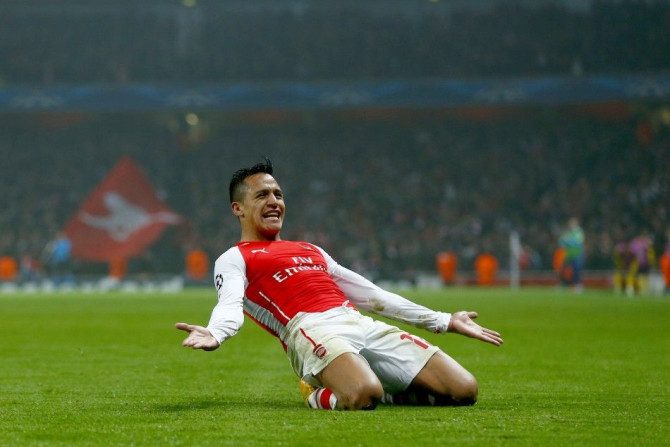 Arsenal&#039;s Alexis Sanchez celebrates after scoring a goal against Borussia Dortmund during their Champions League group D soccer match in London November 26, 2014.