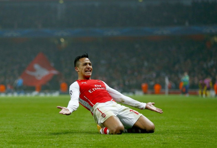 Arsenal&#039;s Alexis Sanchez celebrates after scoring a goal against Borussia Dortmund during their Champions League group D soccer match in London November 26, 2014.