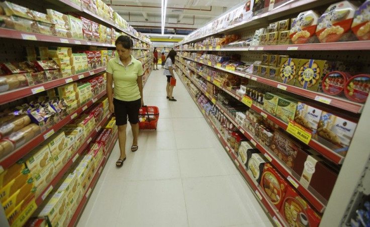 A woman pulls a cart at a supermarket in Hanoi September 20, 2014. REUTERS/Kham