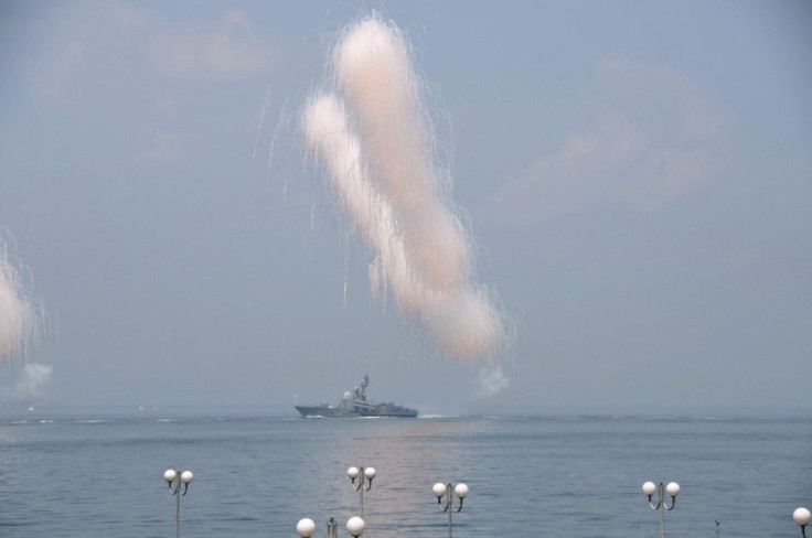 A Russian navy ship sails past exploding anti-missile ordnance during celebrations to mark Navy Day in the far eastern Russian port of Vladivostok July 27, 2014. REUTERS/Yuri Maltsev