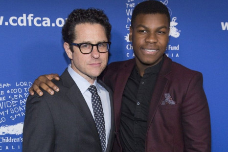 Director J.J. Abrams (L) poses with actor John Boyega at the Children's Defense Fund-California 24th Annual &quot;Beat the Odds&quot; Awards in Culver City, California December 4, 2014.
