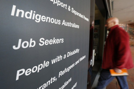 A man walks into a Centrelink, part of the Australian government's department of human services where job seekers search for employment, in a Sydney suburb, August 7, 2014. Australia's jobless rate jumped to a 12-year high of 6.4 percent in July in what c
