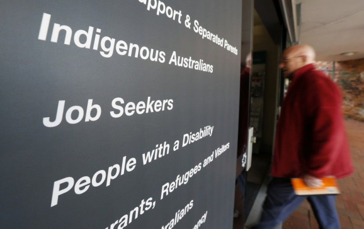 A man walks into a Centrelink, part of the Australian government's department of human services where job seekers search for employment, in a Sydney suburb, August 7, 2014. Australia's jobless rate jumped to a 12-year high of 6.4 percent in July in what c