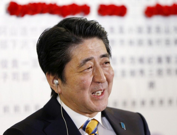 Japan's Prime Minister Shinzo Abe, who is also leader of the ruling Liberal Democratic Party (LDP), reacts during a news conference at the LDP headquarters in Tokyo, December 14, 2014.