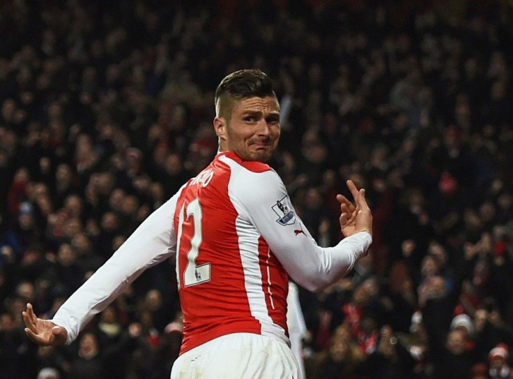 Arsenal's Olivier Giroud celebrates his second goal during their English Premier League soccer match against Newcastle United at the Emirates Stadium in London December 13, 2014.