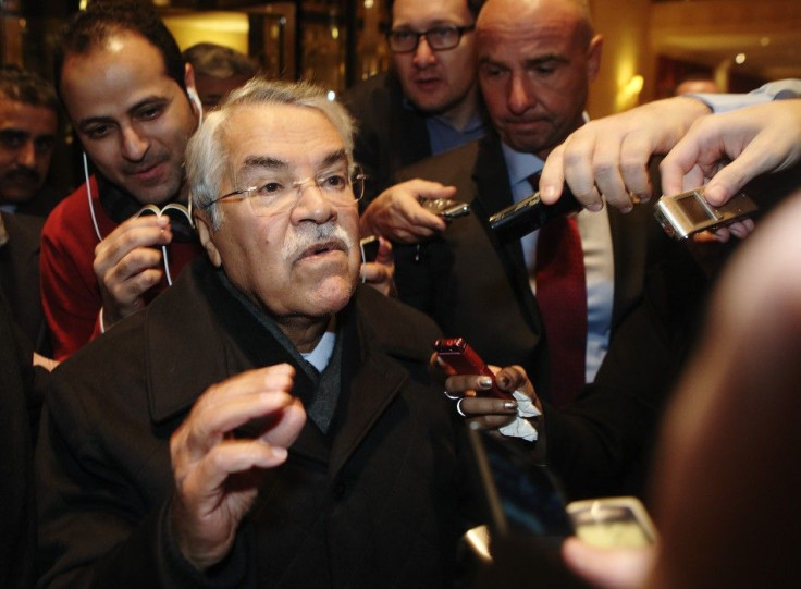 Saudi Arabian Oil Minister Ali al-Naimi gestures as he arrives at his hotel ahead of an OPEC meeting