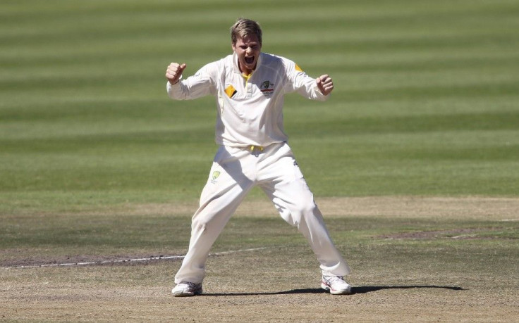 Australia&#039;s Steve Smith celebrates the wicket of Faf du Plessis (not in picture) during the fifth day of the third cricket test match at Newlands Stadium in Cape Town, March 5, 2014.