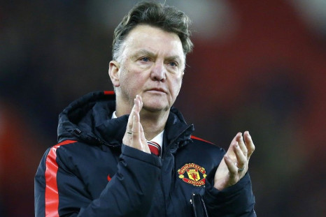 Manchester United manager Louis van Gaal applauds the fans after their English Premier League soccer match against Southampton at St Mary's Stadium in Southampton, southern England December 8, 2014.