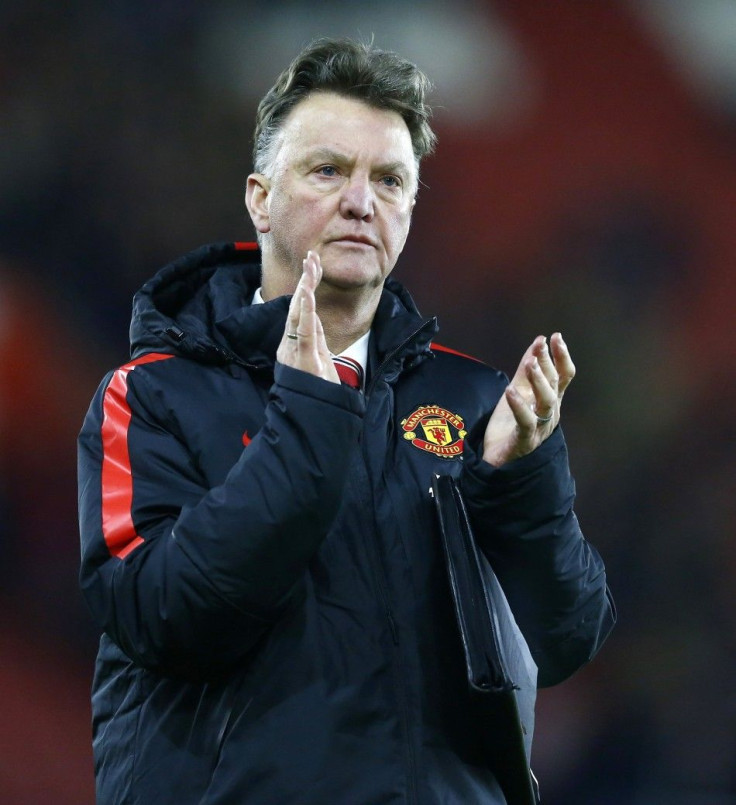 Manchester United manager Louis van Gaal applauds the fans after their English Premier League soccer match against Southampton at St Mary's Stadium in Southampton, southern England December 8, 2014.