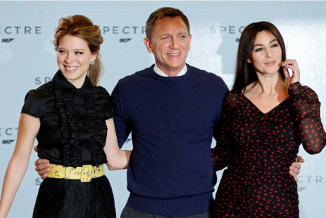 Actors Lea Seydoux, Daniel Craig and Monica Bellucci pose on stage during an event to mark the start of production for the new James Bond film &quot;Spectre&quot;