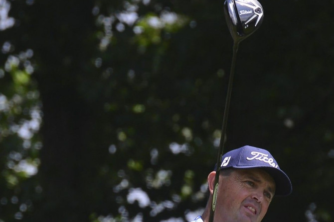 Bethesda, MD, USA; Greg Chalmers hits his tee shot on the fourth hole during the second round of the Quicken Loans National golf tournament at Congressional Country Club - Blue Course.