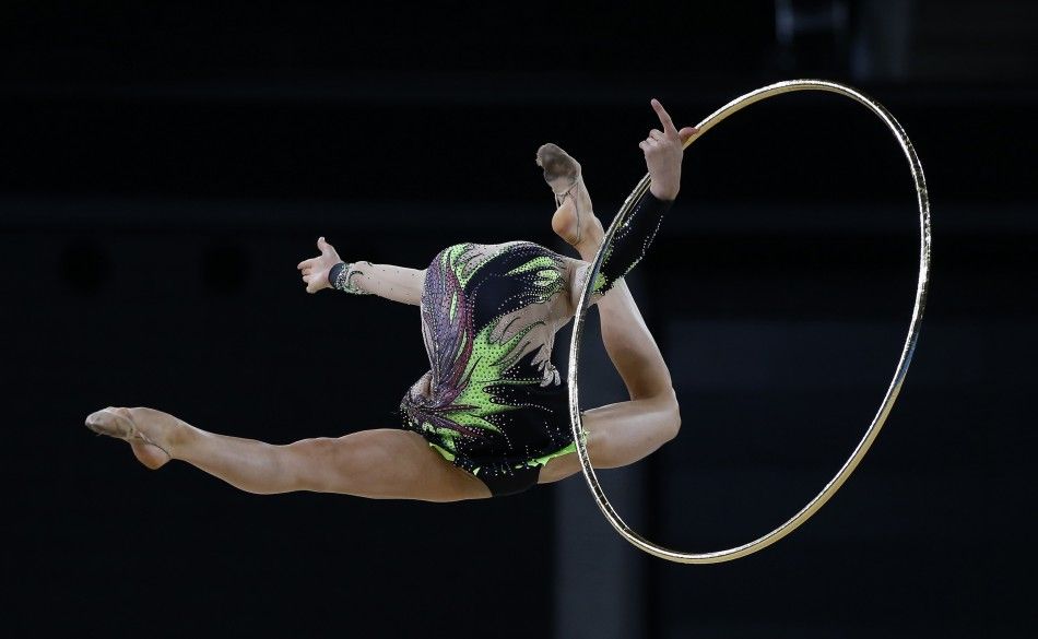 Laura Halford of Wales jumps during her hoop routine as she competes in the rhythmic gymnastics individual all-around final event at the 2014 Commonwealth Games in Glasgow, Scotland, July 25, 2014. 