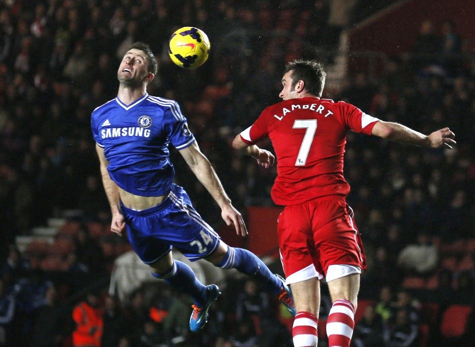 Chelseas Gary Cahill L is challenged by Southamptons Rickie Lambert during their English Premier League soccer match at St Marys stadium in Southampton, southern England January 1, 2014. 