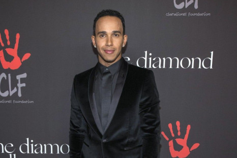 Mercedes Formula One driver Lewis Hamilton of Britain poses at the First Annual Diamond Ball fundraising event at The Vineyard in Beverly Hills, California December 11, 2014. The event benefits the Clara Lionel Foundation (CLF).