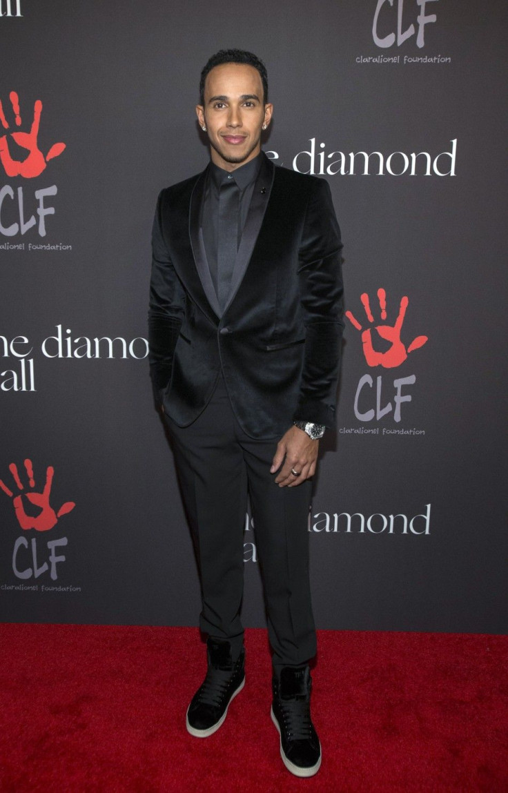 Mercedes Formula One driver Lewis Hamilton of Britain poses at the First Annual Diamond Ball fundraising event at The Vineyard in Beverly Hills, California December 11, 2014. The event benefits the Clara Lionel Foundation (CLF).