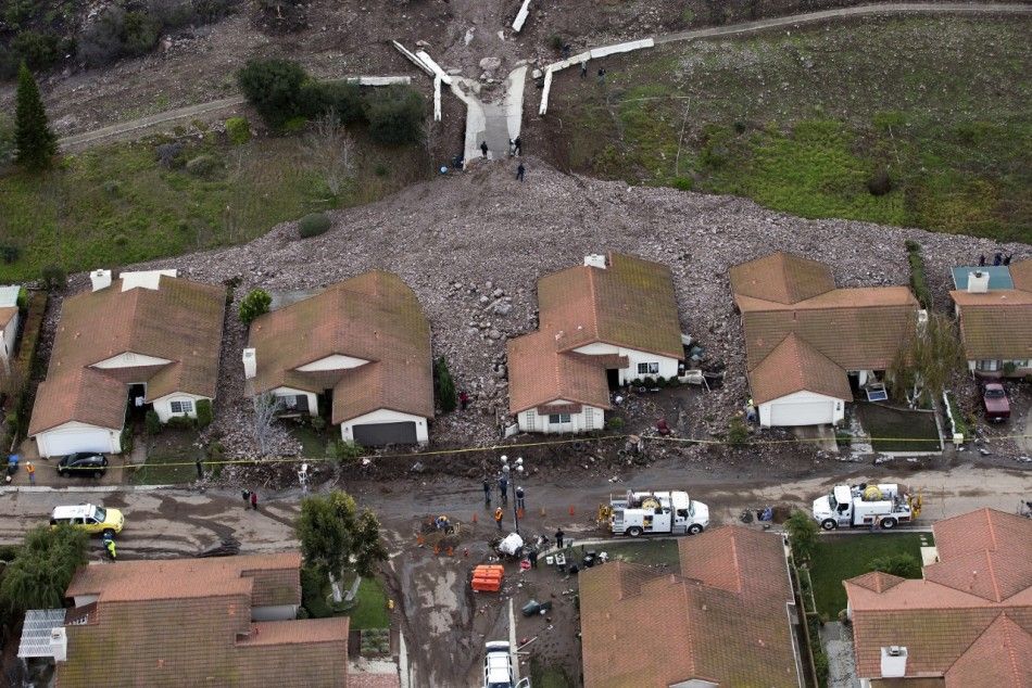 A group of houses are pictured after boulder-strewn rivers of mud swept down hillsides during a winter storm, in Camarillo Springs, California December 12, 2014. A Pacific storm pounded Southern California with heavy rain and high winds on Friday, trigger
