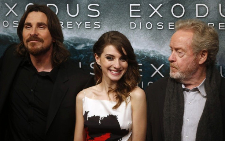 Director Ridley Scott (R) and cast members Christian Bale and Maria Valverde (C) pose for photographs as he arrive for the film world premiere of &quot;Exodus: Gods and Kings&quot; in Madrid , December 4, 2014.