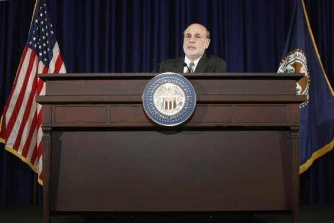 U.S. Federal Reserve Chairman Ben Bernanke responds to reporters during his final planned news conference before his retirement, at the Federal Reserve Bank headquarters in Washington, December 18, 2013.