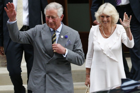 Britain's Prince Charles and his wife Camilla, Duchess of Cornwall leave the Lindo Wing of St Mary's Hospital the day after Catherine, Duchess of Cambridge, gave birth to a baby boy, in London July 23, 2013.