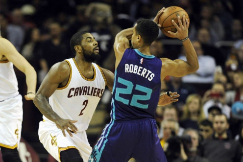 Dec 15, 2014; Cleveland, OH, USA; Cleveland Cavaliers guard Kyrie Irving (2) defends Charlotte Hornets guard Brian Roberts (22) during the second quarter at Quicken Loans Arena.