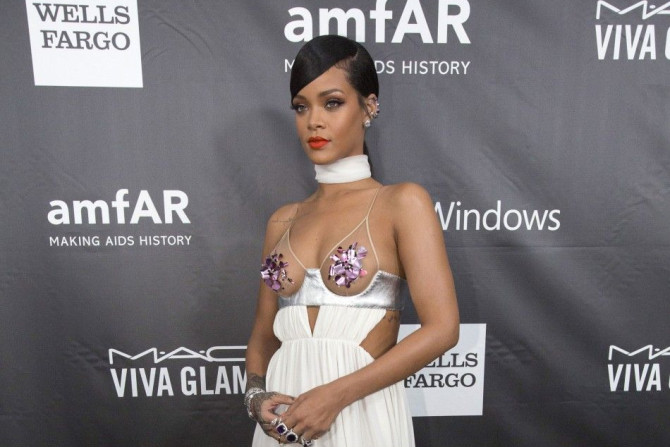 Singer Rihanna poses at amfAR's Fifth Annual Inspiration Gala in Los Angeles, California October 29, 2014. 