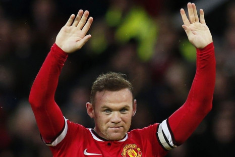 Manchester United's Wayne Rooney celebrates after scoring the opening goal during their English Premier League soccer match against Liverpool at Old Trafford in Manchester, northern England December 14, 2014.