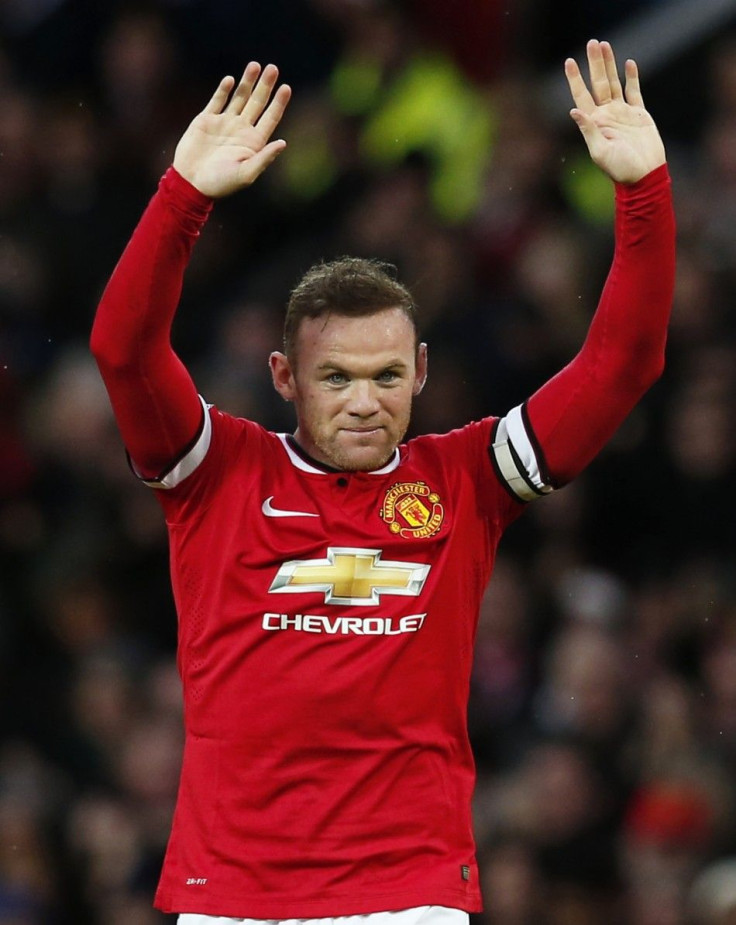 Manchester United's Wayne Rooney celebrates after scoring the opening goal during their English Premier League soccer match against Liverpool at Old Trafford in Manchester, northern England December 14, 2014.