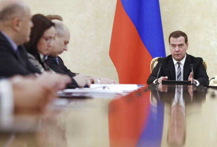 Russian Prime Minister Dmitry Medvedev (R) chairs a meeting on economic issues in Moscow