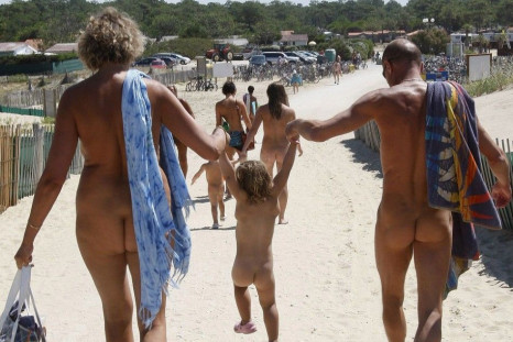 Naturists walk on a sand path as they return from the beach at the Heliomarin Centre on the Atlantic Ocean in Montalivet, southwestern France, on August 5, 2009. Several thousand naturists spend their holidays at the centre during the summer vacation seas