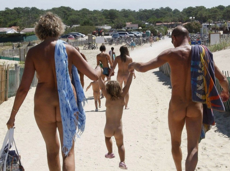 Naturists walk on a sand path as they return from the beach at the Heliomarin Centre on the Atlantic Ocean in Montalivet, southwestern France, on August 5, 2009. Several thousand naturists spend their holidays at the centre during the summer vacation seas