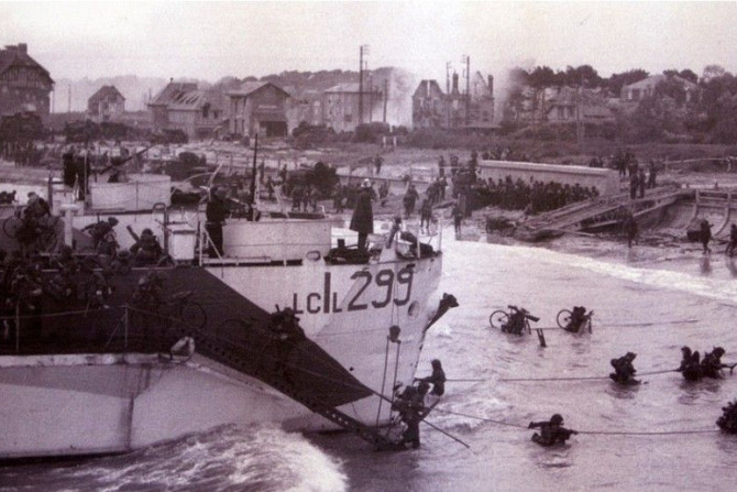Canadian troops wade ashore after landing in the D-Day invasion at Bernieres-sur-Mer