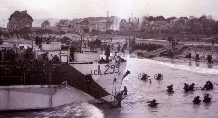 Canadian troops wade ashore after landing in the D-Day invasion at Bernieres-sur-Mer