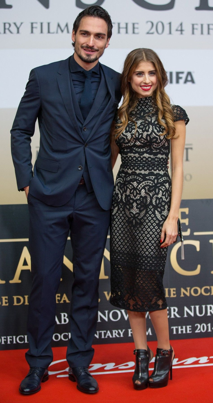 Mats Hummels of the German national soccer team and his girlfriend Cathy Fischer pose at the world premiere of &quot;Die Mannschaft&quot; (The Team) at the Sony Center in Berlin November 10, 2014.