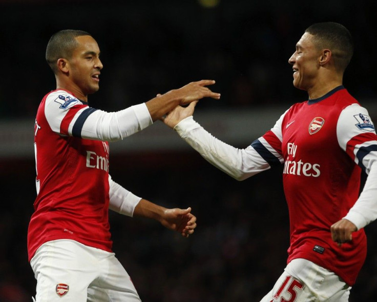 Arsenal&#039;s Theo Walcott (L) celebrates his second goal against Newcastle United with Alex Oxlade-Chamberlain during their English Premier League soccer match at The Emirates stadium in London December 29, 2012.