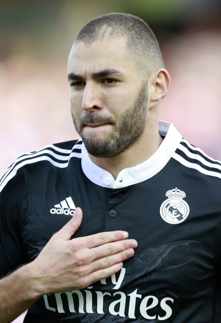 Real Madrid's Karim Benzema celebrates after scoring against Granada during their Spanish First Division soccer match at Nuevo Los Carmenes stadium in Granada, November 1, 2014.