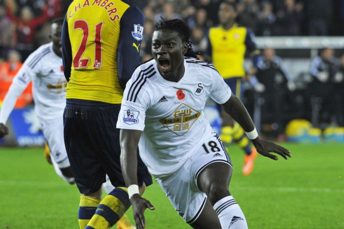 Swansea City's Bafetimbi Gomis celebrates his goal during their English Premier League soccer match against Arsenal at the Liberty Stadium in Swansea, Wales November 9, 2014.