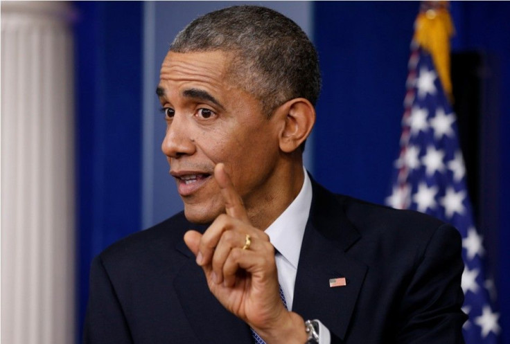 U.S. President Barack Obama gestures as he answers a question during his end of the year press conference