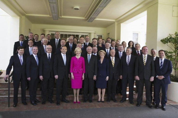 The new Prime Minister of Australia Tony Abbott (front row 4th L) pose with the Governor-General Quentin Bryce (front row 5th L) and his new ministry after their official swearing in at the Government House in Canberra September 18, 2013. Abbott unveiled 