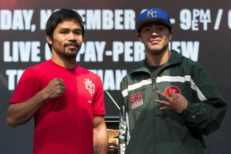 Filipino boxer Manny Pacquiao (L) and Brandon Rios of the U.S. pose after a news conference at the Venetian Macao hotel in Macau November 20, 2013. Pacquiao will fight against American Brandon Rios in a 12-round welterweight clash on November 24.