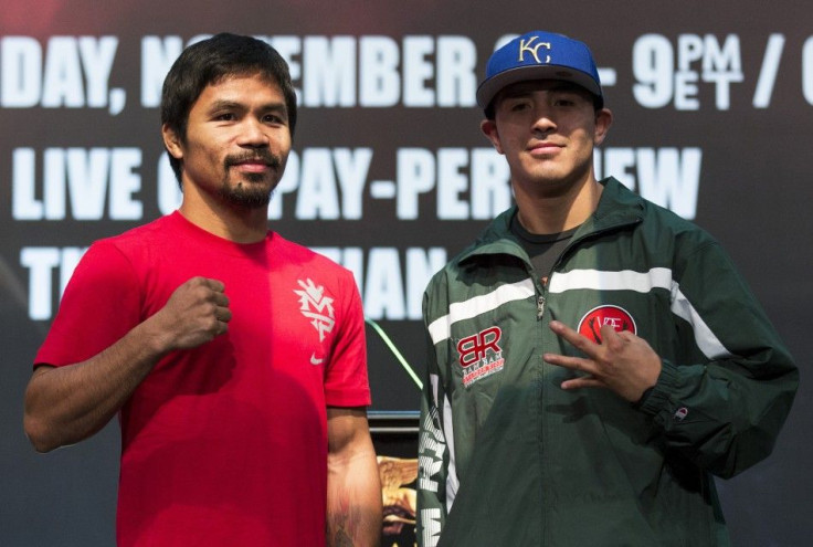 Filipino boxer Manny Pacquiao (L) and Brandon Rios of the U.S. pose after a news conference at the Venetian Macao hotel in Macau November 20, 2013. Pacquiao will fight against American Brandon Rios in a 12-round welterweight clash on November 24.