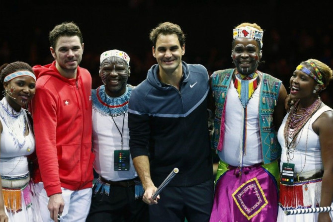 Switzerland&#039;s Roger Federer (C) poses with compatriot Stanislas Wawrinka (2nd L) and artists after &quot;The match for Africa 2&quot; charity tennis match in Zurich December 21, 2014. REUTERS/Arnd Wiegmann