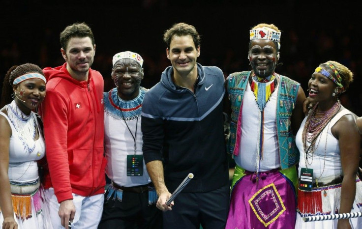 Switzerland&#039;s Roger Federer (C) poses with compatriot Stanislas Wawrinka (2nd L) and artists after &quot;The match for Africa 2&quot; charity tennis match in Zurich December 21, 2014. REUTERS/Arnd Wiegmann
