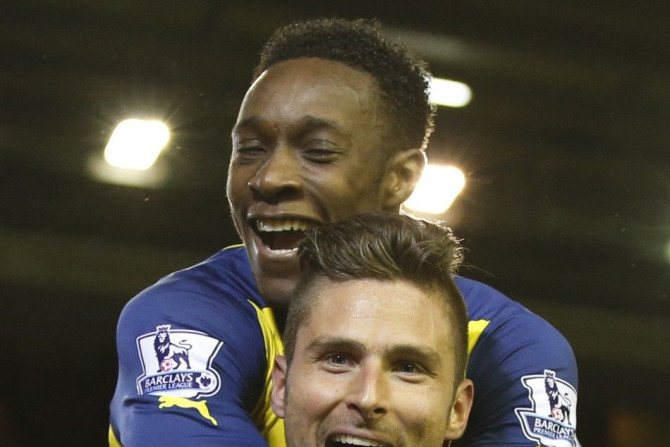 Liverpool, United KingdomArsenal&#039;s Olivier Giroud (FRONT) celebrates with team-mate Danny Welbeck after scoring a goal during their English Premier League soccer match against Liverpool at Anfield in Liverpool, northern England December 21, 2014.