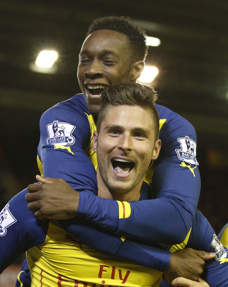 Liverpool, United KingdomArsenal&#039;s Olivier Giroud (FRONT) celebrates with team-mate Danny Welbeck after scoring a goal during their English Premier League soccer match against Liverpool at Anfield in Liverpool, northern England December 21, 2014.